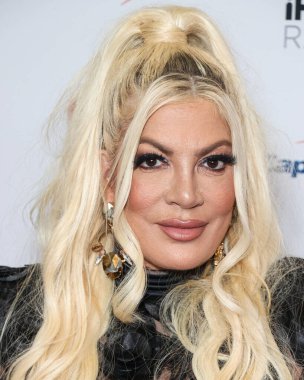 Tori Spelling, 23 Eylül 2022 'de Las Vegas, Nevada' da T-Mobile Arena 'da düzenlenen iHeartRadio Music Festival' de basın odasında poz verdi.