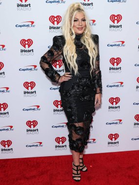 Tori Spelling, 23 Eylül 2022 'de Las Vegas, Nevada' da T-Mobile Arena 'da düzenlenen iHeartRadio Music Festival' de basın odasında poz verdi.
