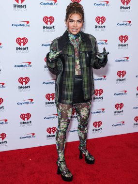 Hayley Kiyoko, 24 Eylül 2022 'de Las Vegas, Nevada' da T-Mobile Arena 'da düzenlenen iHeartRadio Music Festival' de basın odasında poz verdi.. 