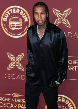 Rapçi Tyga (Micheal Ray Stevenson), 26 Mart 2022 tarihinde Bel Air, Los Angeles, Kaliforniya, ABD 'de düzenlenen Darren Dzienciol ve Richie Akiva Oscar Partisi 2022' ye geldi.. 