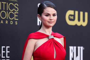 Selena Gomez wearing Louis Vuitton arrives at the 27th Annual Critics' Choice Awards held at the Fairmont Century Plaza Hotel on March 13, 2022 in Century City, Los Angeles, California, United States. 