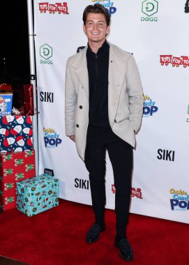 Singer Jamie Miller arrives at Katie Welch And Jordan Kuker's 8th Annual Winter Wonderland Toys for Tots Charity Event presented by SIKI.io, DOGG coin, Candy Pop and Cookie Pop and Tito's Vodka held at Yamashiro Hollywood on December 8, 2021 clipart