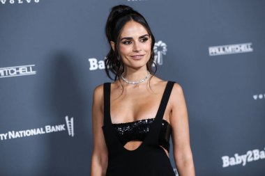 Actress Jordana Brewster wearing a Monot dress and Vrai jewelry arrives at the Baby2Baby 10-Year Gala 2021 held at the Pacific Design Center on November 13, 2021 in West Hollywood, Los Angeles, California, United States. clipart