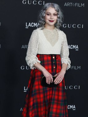 Singer-songwriter Phoebe Bridgers wearing a Gucci outfit arrives at the 10th Annual LACMA Art + Film Gala 2021 held at the Los Angeles County Museum of Art on November 6, 2021 in Los Angeles, California, United States. clipart