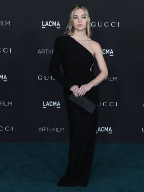Sydney Sweeney wearing a Saint Laurent dress arrives at the 10th Annual LACMA Art + Film Gala 2021 held at the Los Angeles County Museum of Art on November 6, 2021 in Los Angeles, California, United States.  clipart
