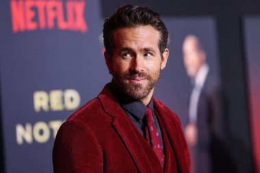 Actor Ryan Reynolds arrives at the World Premiere Of Netflix's 'Red Notice' held at the Xbox Plaza and Chick Hearn Court at L.A. Live on November 4, 2021 in Los Angeles, California, United States. clipart