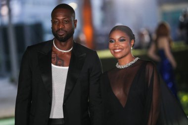 Eski profesyonel basketbol oyuncusu Dwyane Wade ve eşi / aktris Gabrielle Union, 25 Eylül 2021 'de ABD' nin Los Angeles kentinde bulunan Akademi Film Müzesi 'nin açılış galasına geldiler.
