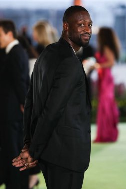 Former professional basketball player Dwyane Wade wearing a Gucci suit and Tiffany & Co. jewelry arrives at the Academy Museum of Motion Pictures Opening Gala held at the Academy Museum of Motion Pictures on September 25, 2021 in Los Angeles, USA
