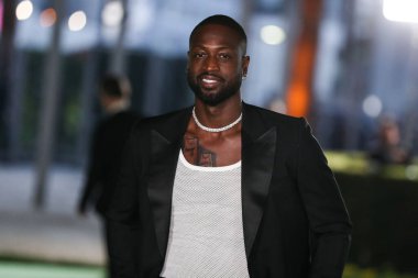 Former professional basketball player Dwyane Wade wearing a Gucci suit and Tiffany & Co. jewelry arrives at the Academy Museum of Motion Pictures Opening Gala held at the Academy Museum of Motion Pictures on September 25, 2021 in Los Angeles, USA