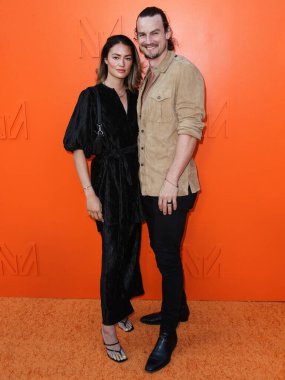 Stylist Kara Cook and husband/actor Luke Cook arrive at the MARCELL VON BERLIN Spring/Summer 2021 Runway Fashion Show held at the SheatsGoldstein Residence on September 16, 2021 in Beverly Hills, Los Angeles, California, United States.  clipart