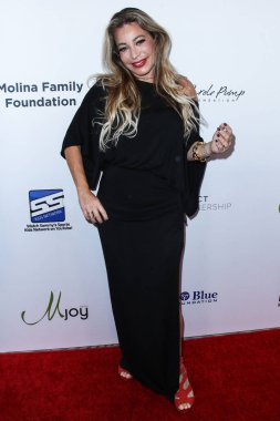 Şarkıcı / söz yazarı Taylor Dane, 20 Ağustos 2021 'de Beverly Hilton Hotel' de düzenlenen 21. Geleneksel Harold ve Carole Pompa Vakfı Galasına geldi.. 