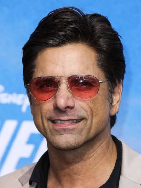 Actor John Stamos arrives at the Disney+ 'Turner & Hooch' Los Angeles Premiere Event held at the Westfield Century City Mall on July 15, 2021 in Century City, Los Angeles, California, United States.