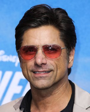 Actor John Stamos arrives at the Disney+ 'Turner & Hooch' Los Angeles Premiere Event held at the Westfield Century City Mall on July 15, 2021 in Century City, Los Angeles, California, United States.