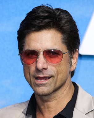 Actor John Stamos arrives at the Disney+ 'Turner & Hooch' Los Angeles Premiere Event held at the Westfield Century City Mall on July 15, 2021 in Century City, Los Angeles, California, United States.