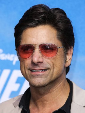 Actor John Stamos arrives at the Disney+ 'Turner & Hooch' Los Angeles Premiere Event held at the Westfield Century City Mall on July 15, 2021 in Century City, Los Angeles, California, United States.