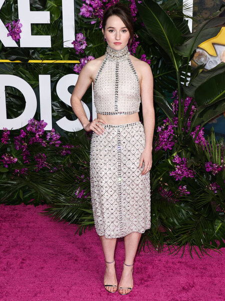 American actress Kaitlyn Dever wearing a Miu Miu top and skirt arrives at the Los Angeles Premiere Of Universal Pictures' 'Ticket To Paradise' held at Regency Village Theatre on October 17, 2022 in Westwood, Los Angeles, California, United States.
