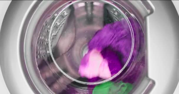 Washing machine while washing colored laundry close-up. — Stock Video
