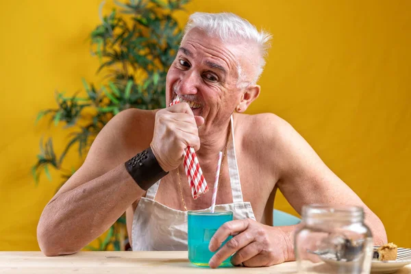 Handsome Middle Aged Man Sitting Table Drinking Blue Soft Beverage — Zdjęcie stockowe