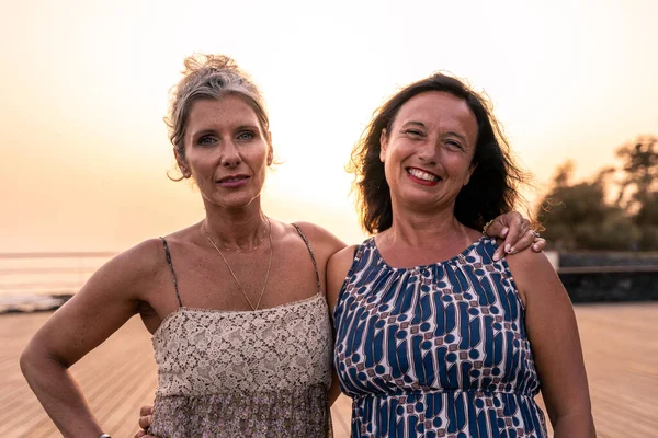 Portrait Two Lovely Middle Aged Girlfriends Hugging Each Other Sea — Stock Photo, Image