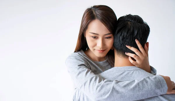 Upset Asian Wife Embracing Husband Misunderstanding Infidelity White Background Sad — Stock Photo, Image