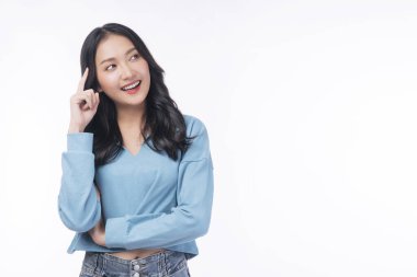 Positive Asian woman think choice creative on white background. Smile girl thinking about question, pensive expression something over isolated. Lady thoughtful doubt holding finger on head looking up.
