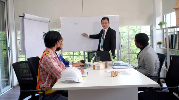 Group of businesspeople planning project job cooperation at workplace. Ceo speak new growth business colleagues learning together in office. Professional multiracial discussion collaboration briefing.