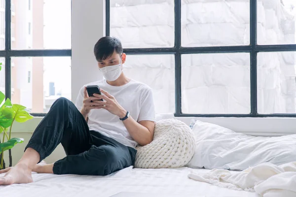 Asian Casual Man Wear Medical Mask Safety Health Using Smartphone — Fotografia de Stock