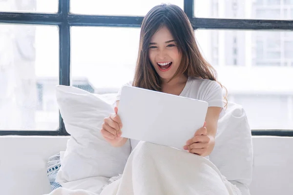 Excited Asian Woman Play Gaming Online Tablet Sitting Window Home — Stock fotografie