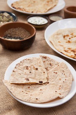 Plain Naan, Aloo Naan, Garlic Cheese Naan, Garlic Naan, Indian food, Bowls and plates with indian food top view, spice