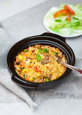 Chinese fried rice, salad, spice, bowls, and plates with food top view   