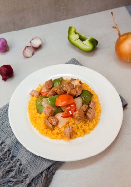 Vietnamese Shaking Beef, salad,  bowls, and plates with food top view