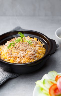 Com Nieu VietNam salty fish, salad, bowls, and plates with food top view  