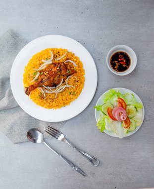 Vietnamese Chicken Fat Rice, salad, bowls, and plates with food top view  