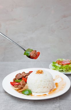 Vietnamese Shaking Beef, salad,  bowls, and plates with food top view