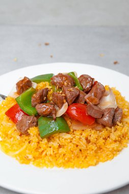 Vietnamese Shaking Beef, salad,  bowls, and plates with food top view