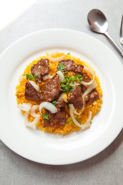 Vietnamese Shaking Beef, salad,  bowls, and plates with food top view