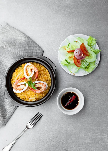 Com Nieu VietNam seafood, salad, bowls, and plates with food top view  