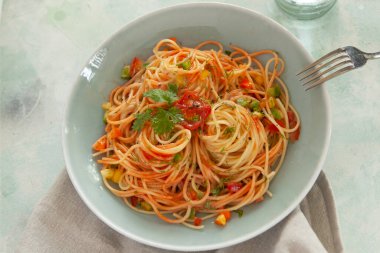 Tomato sauce pasta, bowls, and plates with food top view
