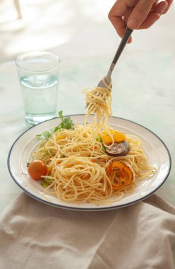 Tomato sauce pasta, bowls, and plates with food top view
