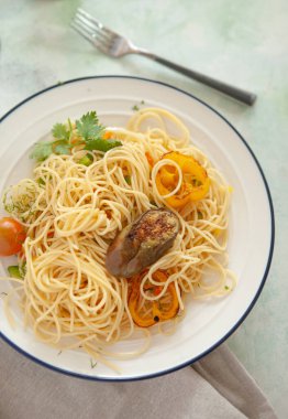 Tomato sauce pasta, bowls, and plates with food top view