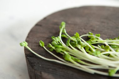 Sprouts on a wooden cutting board