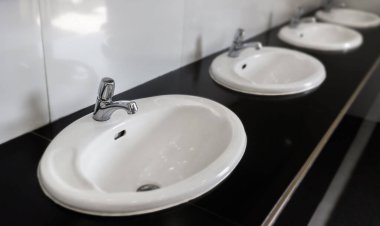 Top view of chrome faucet wash basin.  sink on countertop in bathroom. Interior design elements.