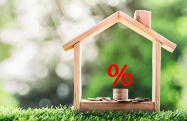 Mortgage rates business concept of investment housing real estate interest rates 3d home appraisal. planning savings money of coins to buy a home concept for property ladder, mortgage, real estate.