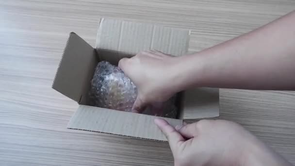 Man Hand Opening Parcel Taking Out Contents Box Open Bubble — Stock Video