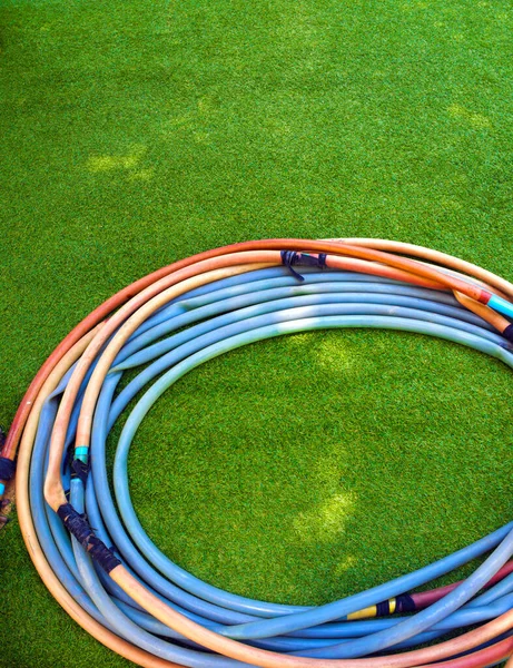 Old Rubber Hose Artificial Grass — 스톡 사진