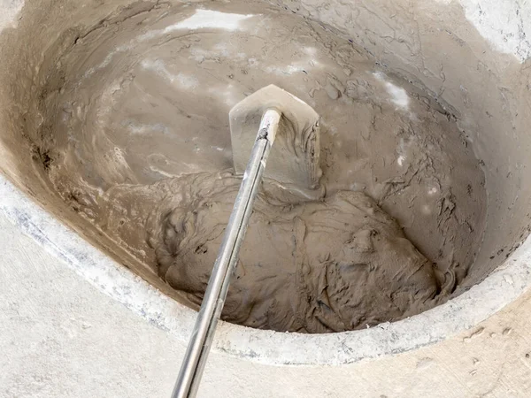 Concrete is mixed in a concrete mixing bowl