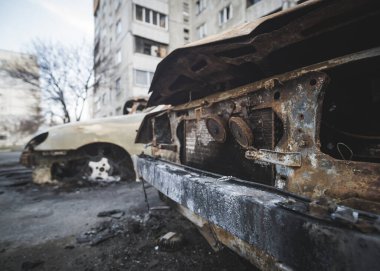 Cars burned to the skeleton after shelling by rocket artillery in a residential area in Ukraine during a military escalation of hostilities and armed military aggression