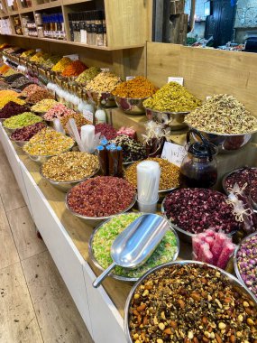 Market view with various plates of spices and sweets