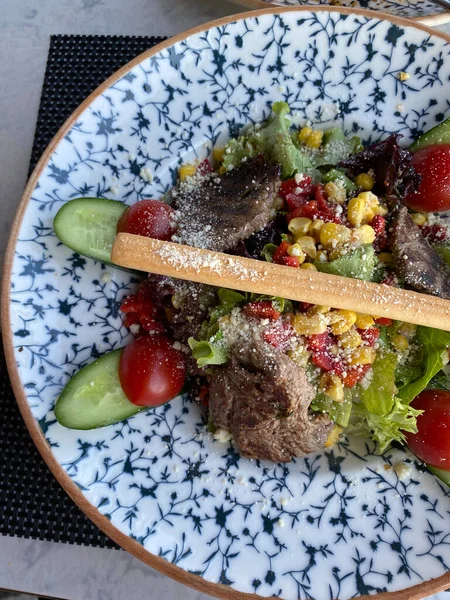 Close-up of beef salad on a beautiful plate