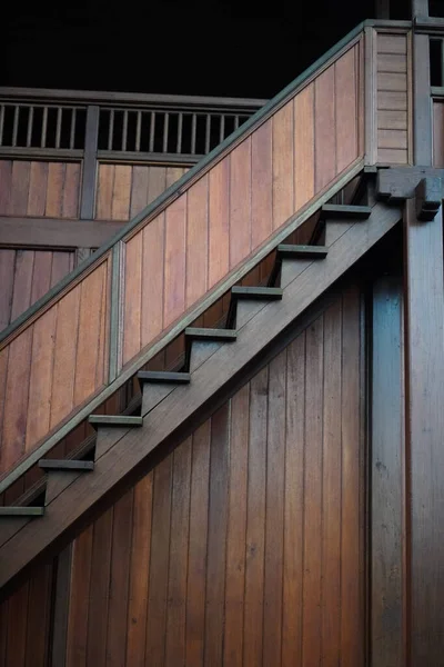 Close-up photo of natural wood stairs outdoors,the unique architecture of a building
